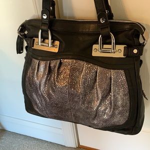 Silver and black leather bag.